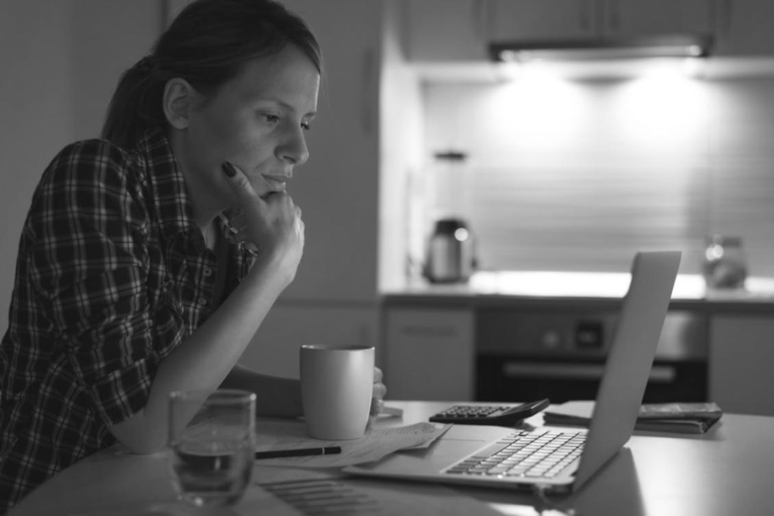 Database administrator reviewing system logs and performance reports